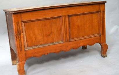 Moulded cherry wood chair resting on two...