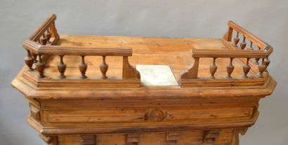 Carved and molded pine counter with a gallery...