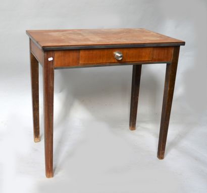 Middle table opening with a drawer in the...