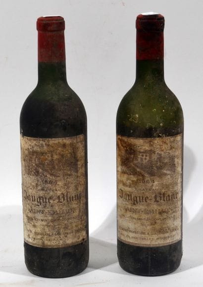 2 bouteilles de CHATEAU JAUGUE-BLANC 1964...