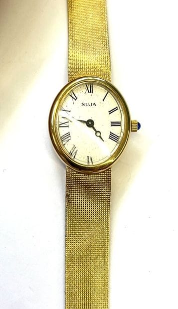 SUJA Genève 

Montre de dame en or jaune...