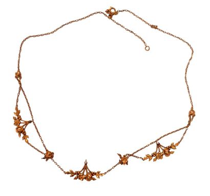 COLLIER en or jaune 18K (750/1000e) à décor...