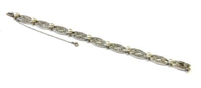 BRACELET en or gris 18k (750/1000e) à décor...
