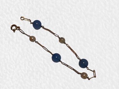 BRACELET en or jaune 18K (750/1000e) à décor...