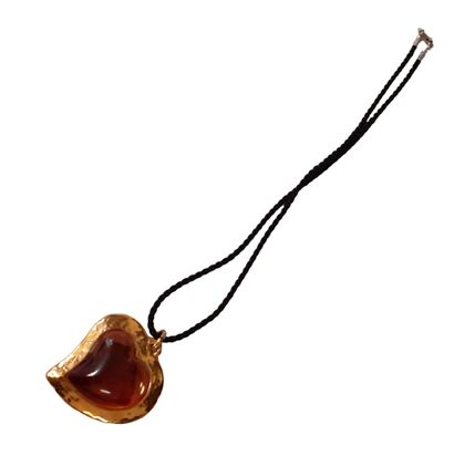 YVES SAINT LAURENT

Pendentif en métal doré...