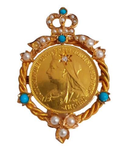 BROCHE en or jaune 18 K (750/oo) centrée...