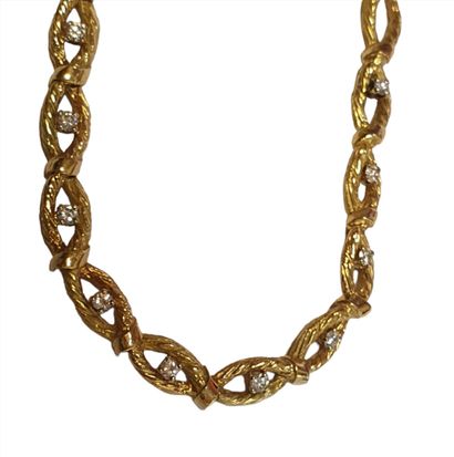 COLLIER en or jaune 18K (750/1000e) à mailles...