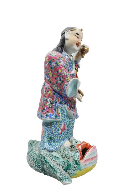 CHINE
Personnage surmontant un crapaud stylisé...
