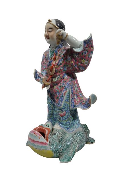 CHINE
Personnage surmontant un crapaud stylisé...