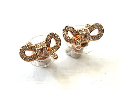 SWAROVSKI
Paire de boutons d'oreille en acier...