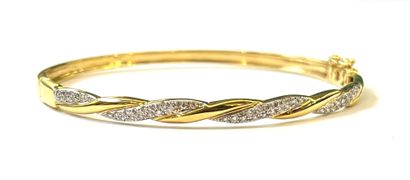 Bracelet rigide en or jaune 14 K (375/oo)...