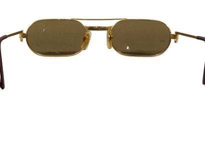CARTIER
Paire de lunettes de soleil en métal...