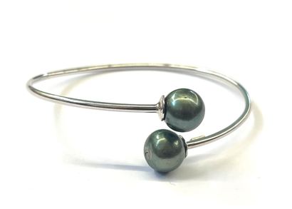 BRACELET jonc 925/°° terminé par deux perles...