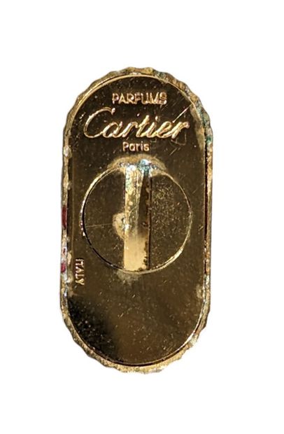 CARTIER
Vaporisateur en métal doré et laque...