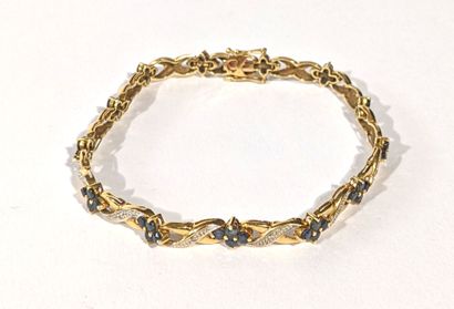 BRACELET en or jaune 750‰ sertie de diamants...