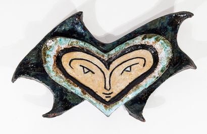 APPLIQUE en céramique émaillée figurant un...