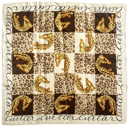 CARTIER
Silk square with panther motif.
65...