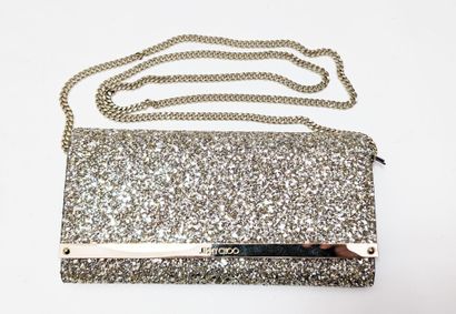 JIMMY CHOO. 
Clutch covered in silver and...