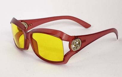 GUCCI
Transparent acetate sunglasses in red,...