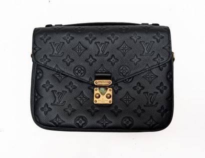 LOUIS VUITTON
Metis clutch bag in blue Monogram-embossed...