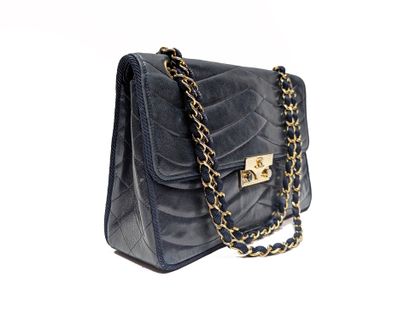 CHANEL
Navy leather bag with wave-pattern...