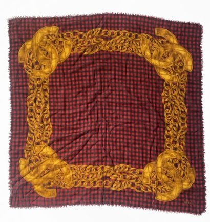 CHANEL
A square muslin scarf with a black-and-red...