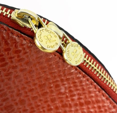 COURREGES
Red leather handbag, oval-shaped,...