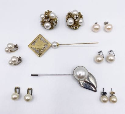 A set of metal earrings adorned with costume...