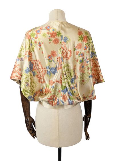 MAX MARA
Beige silk wrap top with a green,...