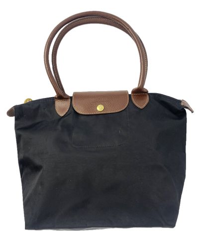 LONGCHAMP
Set of fabric leather goods, including...