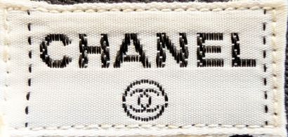 CHANEL
Black straight skirt, fitted at the...
