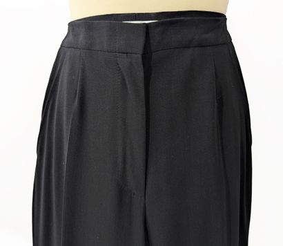 MAX MARA
Black pleated pants with a flowing...