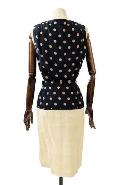 CHANEL - Store
Three-piece set:
- Ecru jacket...