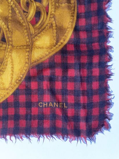 CHANEL
A square muslin scarf with a black-and-red...