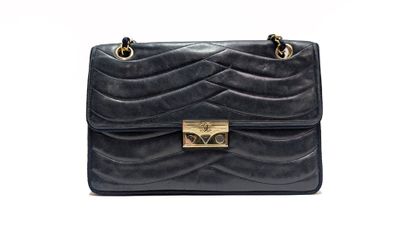 CHANEL
Navy leather bag with wave-pattern...