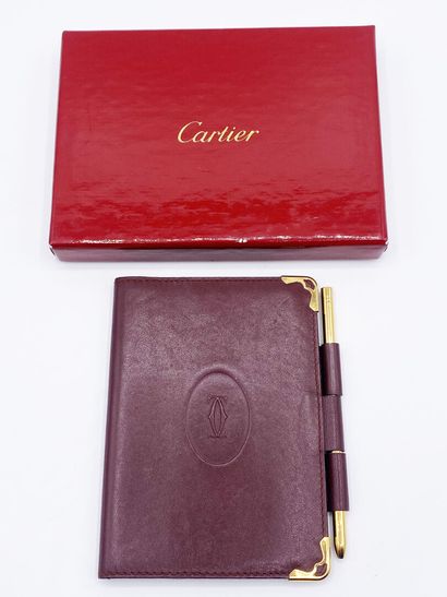 CARTIER
Burgundy leather planner case, with...