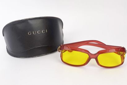 GUCCI
Transparent acetate sunglasses in red,...