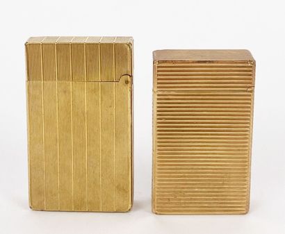 ST DUPONT
Two gold-plated metal lighters...