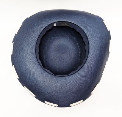 CHANEL
Women's navy blue woven straw hat...