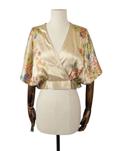 MAX MARA
Beige silk wrap top with a green,...