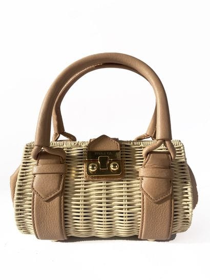 PAULE KA
Small crossbody bag in a wooden...