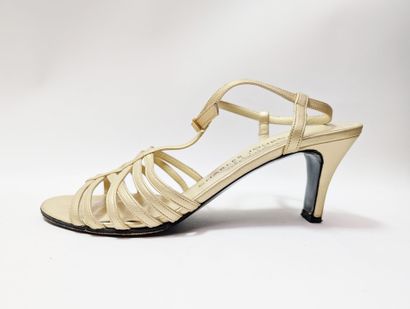 CHARLES JOURDAN
Pair of gold-colored leather...