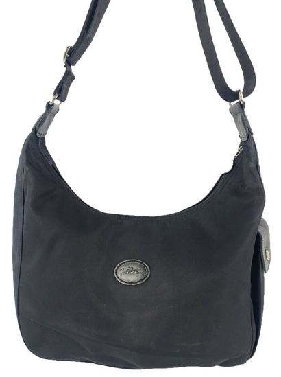 LONGCHAMP
Set of fabric leather goods, including...