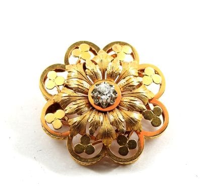 BROCHURE flower in yellow gold 750 thousandths...
