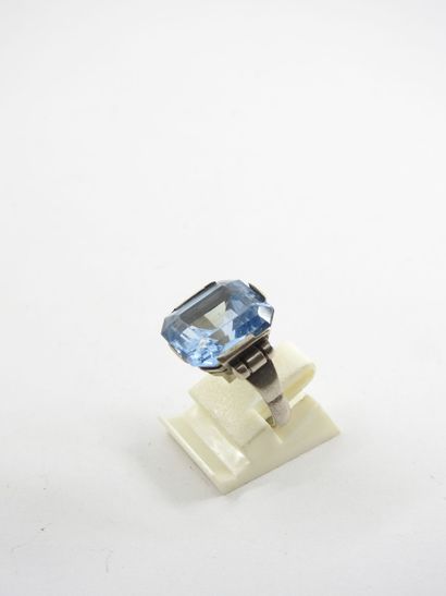 Silver ring decorated with a blue stone....