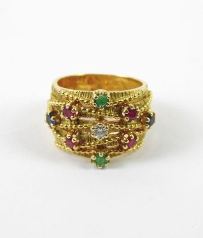 Yellow gold ring made of five rings decorated...