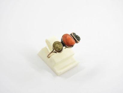 Gilded metal ring decorated with three heads...