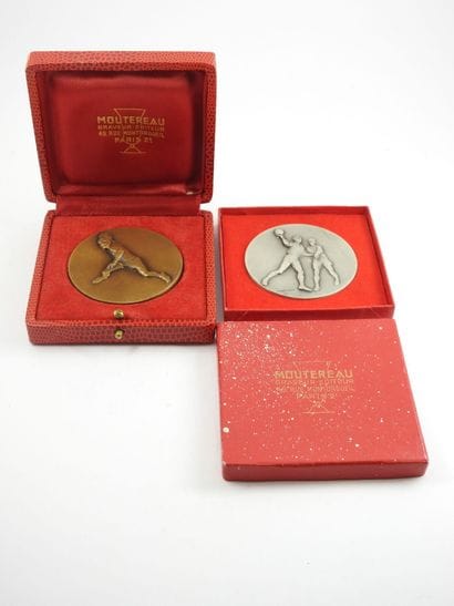 Two bronze CONTAUX sports medals. In a c...