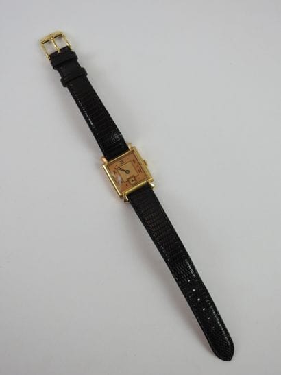 ROLEX: Man's watch, square case in yellow...