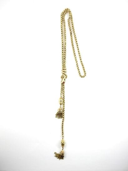 Tie necklace in yellow gold decorated with...
